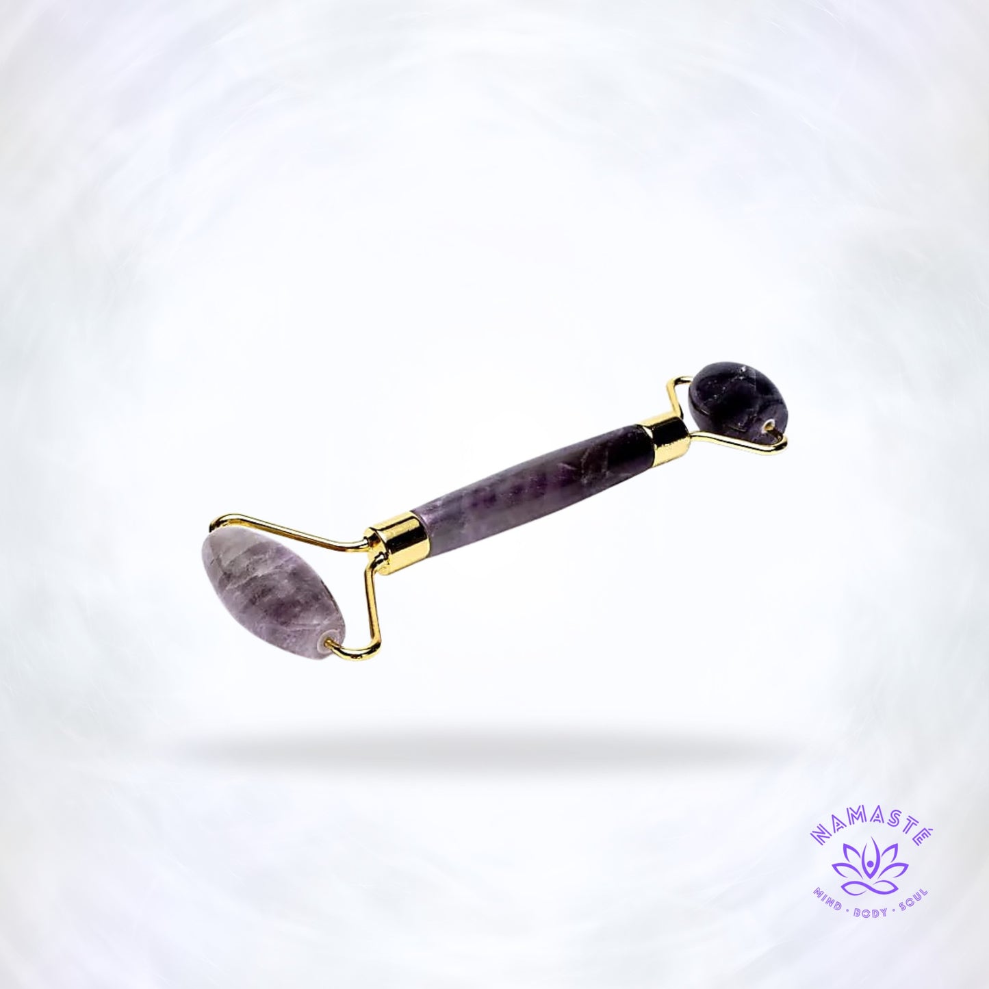 Amethist gezichtsmassage roller met goudkleurige details in paarse tinten.