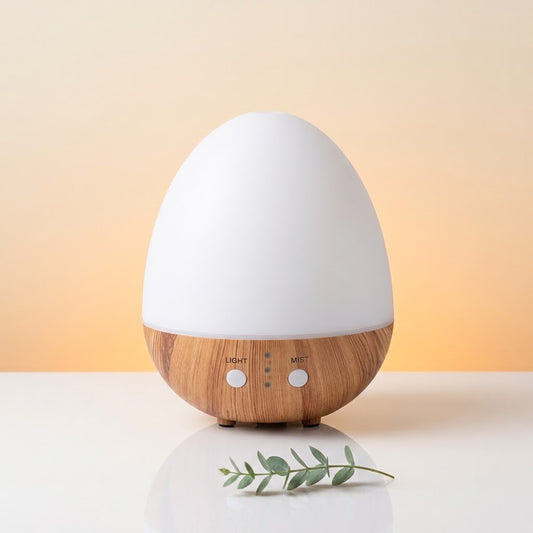diffuser op een gradient achtergrond op witte tafel met takje