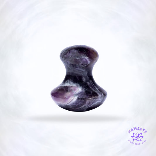 Amethist massage tool in paddenstoelvorm in paarse edelsteentinten.