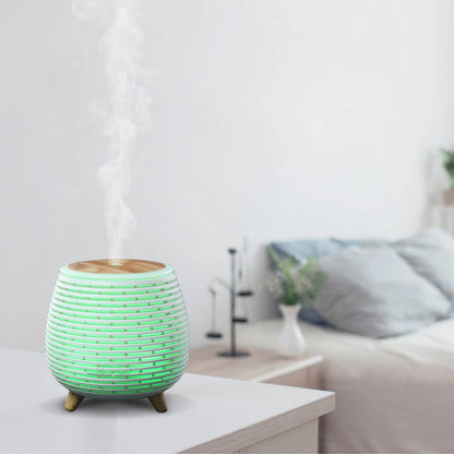 lina diffuser met groen licht op een nachttafel